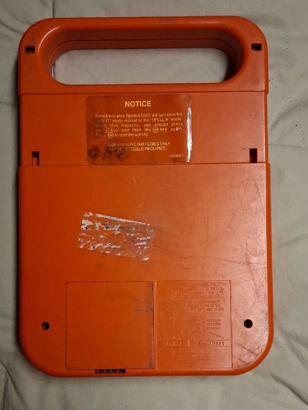 Texas Instruments Orange and Yellow Speak & Spell Handheld Learning Console